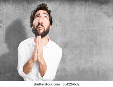 young funny man praying. worried pose