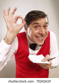 Young And Funny Waiter Portrait On White Background.