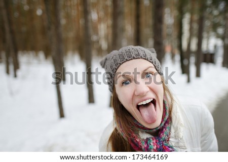 Young funny woman being silly on winter
