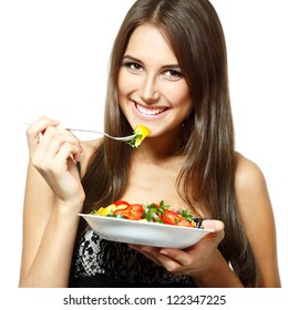 Young Funny Woman Eating Salad Over White Background