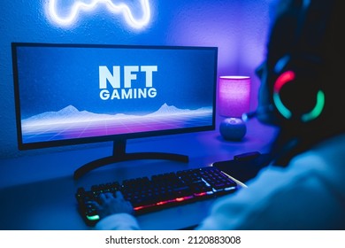 Young gamer buying NFT with token on marketplace platform for metaverse video game - Crypto technology trends - Focus on computer monitor - Shutterstock ID 2120883008