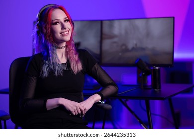 Young gamer streaming in colorful ambiance with professional setup