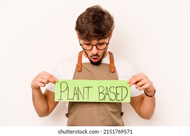 Young Gardener Man Holding Plant Based Placard Isolated On White Background