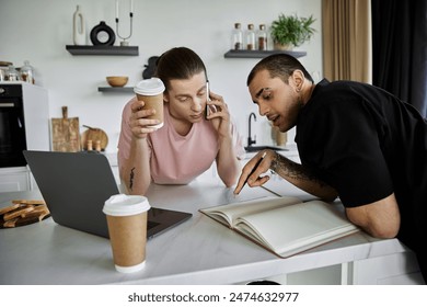 A young gay couple enjoys a morning coffee and plans their day in their modern kitchen. - Powered by Shutterstock