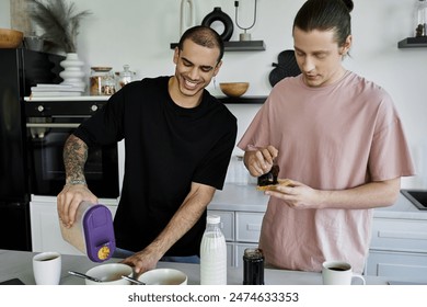 A young gay couple enjoys a relaxed morning routine in their modern kitchen, preparing breakfast together. - Powered by Shutterstock