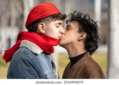 Young gay couple kissing in a park - Powered by Shutterstock