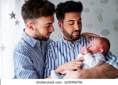 A Young Gay Couple With Their Son - Gay Parents Concept
