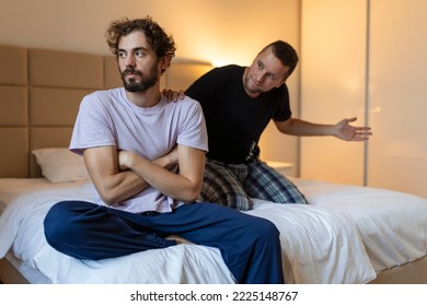 Young Gay LGBTQ Couple Having Relationship Difficulties And Arguing At Home.