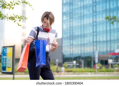 Young Gay Man Shopping. Holding Shopping Bags