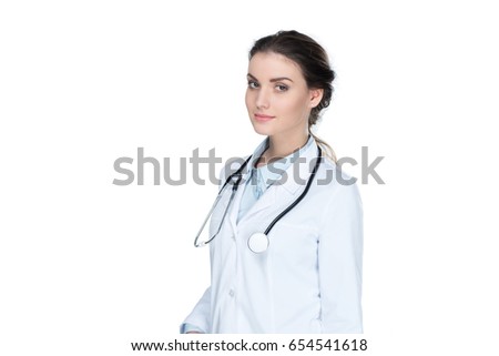 young general practitioner with stethoscope looking at camera isolated on white
