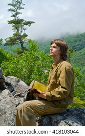 Young Geologist In Mountain Taiga.