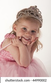young girl (3 years old) dressed in fairy princess costume against white background