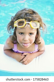 A Young Girl In Aa Blow Up Pool