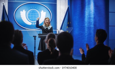 Young Girl Activist Delivering An Emotional And Powerful Speech At Press Conference In Government Building. Child Speaking To Congress At Summit Meeting. Backdrop With European Union Flags.