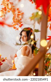 A Young Girl In Autumn, In A White Dress And Jacket In Autumn Scenery With Long Loose Hair Curls