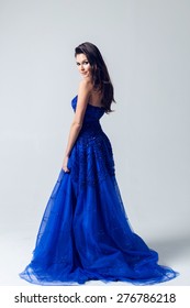 Young Girl In A Beautiful Blue Evening Dress