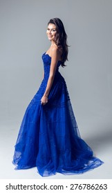 Young Girl In A Beautiful Blue Evening Dress