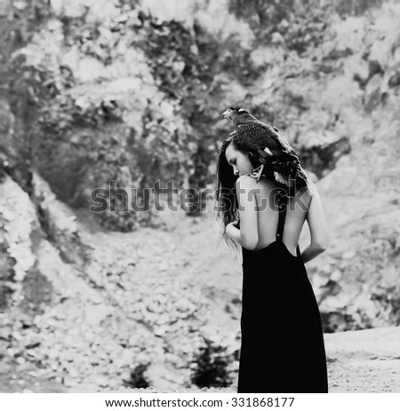 Similar – beautiful brunette short hair girl leaning on gray rock wall outdoors smiling happy