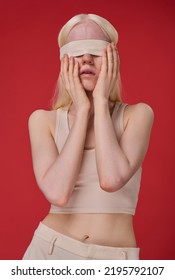 Young Girl With Blindfolded Eyes