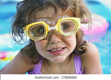 A Young Girl In A Blow Up Pool