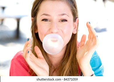 Young Girl Blowing Bubble Gum