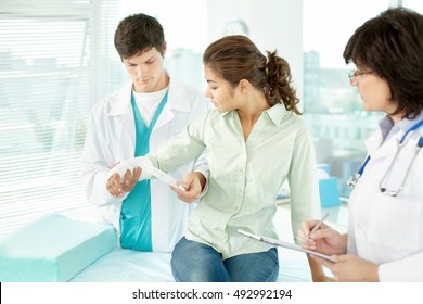 Young Girl With Broken Arm At The Doctor Office