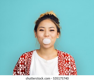 Young Girl Chewing Bubble Gum Concept