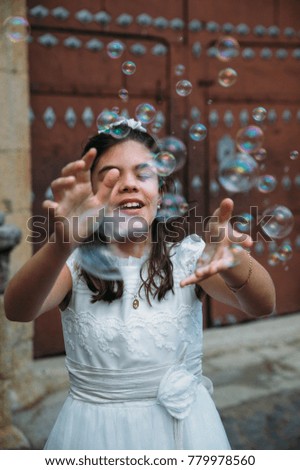 Similar – Image, Stock Photo Girl plucks off a piece of cotton candy