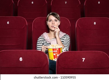 Young Girl At The Cinema Watching A Movie