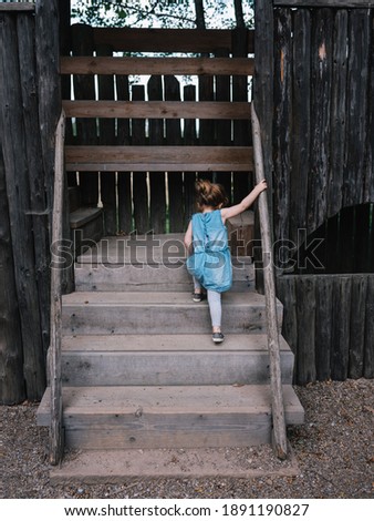 Similar – Image, Stock Photo Little girl climbing to a wooden observation tower in a wetland