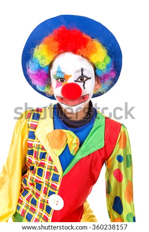 Young girl with clown costume isolated in white