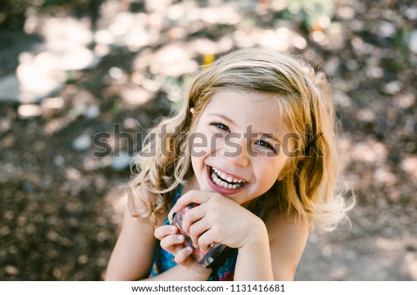 Young Girl Curly Blonde Hair Smiling Stock Photo Edit Now 1131416681