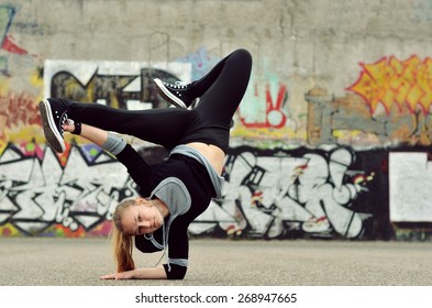 Young Girl Dancing Breakdance On The Street