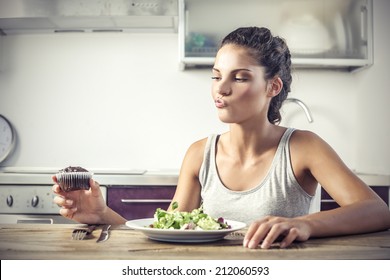 Young Girl Deciding Whether To Eat Healthy Food Or A Sweet