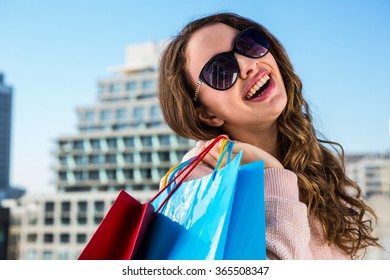 Young girl doing shopping in a sunny day Foto Stock