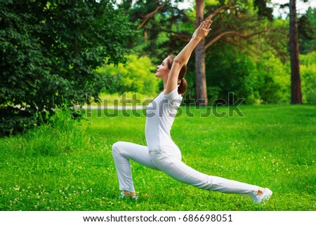 Young woman doing yoga in nature