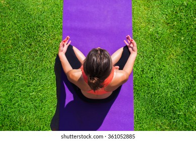 Young Girl Doing Yoga In The Park