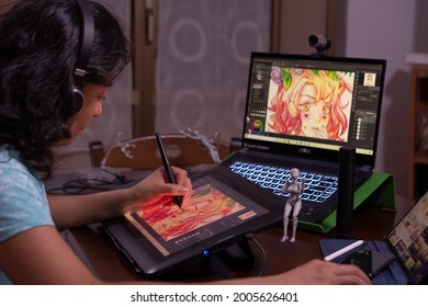 Young girl drawing on digital tablet. Caserta, Italy, July 07th 2021.