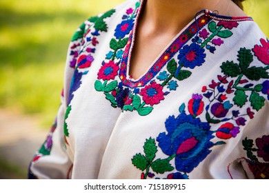 Young Girl Is Dressed In An Embroidered Shirt..