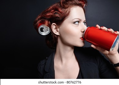 Young Girl Drinking From A Can