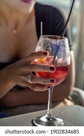 Young Girl Drinking Red Lip Cocktail Close Up.

