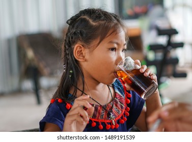 Young Girl Is Drinking Soft Drink.                  