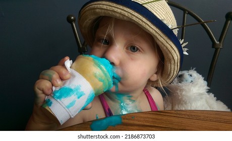 Young Girl Eating Bubble Gum Ice Cream With Stuffy