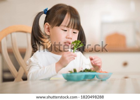 Similar – Image, Stock Photo portrait adorable child eating chocolate sponge cake