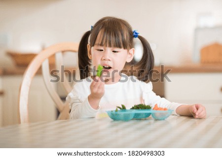 Similar – Image, Stock Photo portrait adorable child eating chocolate sponge cake