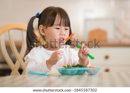 Similar – Image, Stock Photo portrait adorable child eating chocolate sponge cake