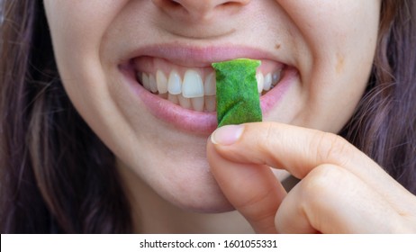 Young Girl Eats Snus Tobacco For Use Through Gums