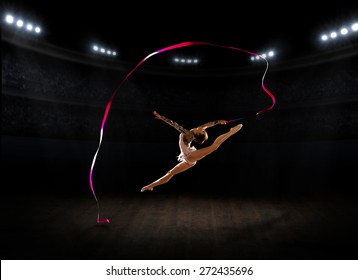 Young girl engaged art gymnastic at sports hall - Powered by Shutterstock