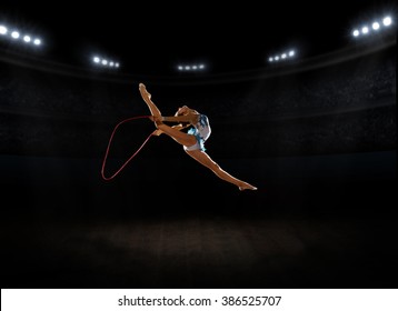 Young girl engaged art gymnastic at sports hall - Powered by Shutterstock