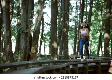 Young girl enjoying outdoors workout - young attractive and fit afro American woman running at countryside road in sport practice and healthy lifestyle - Powered by Shutterstock